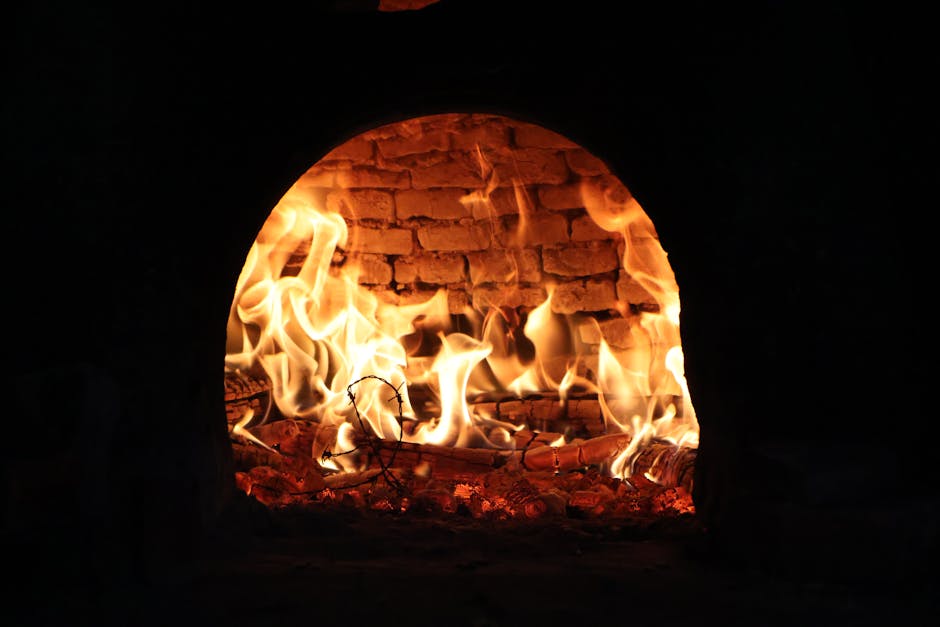 Wood burning pizza oven with flames inside